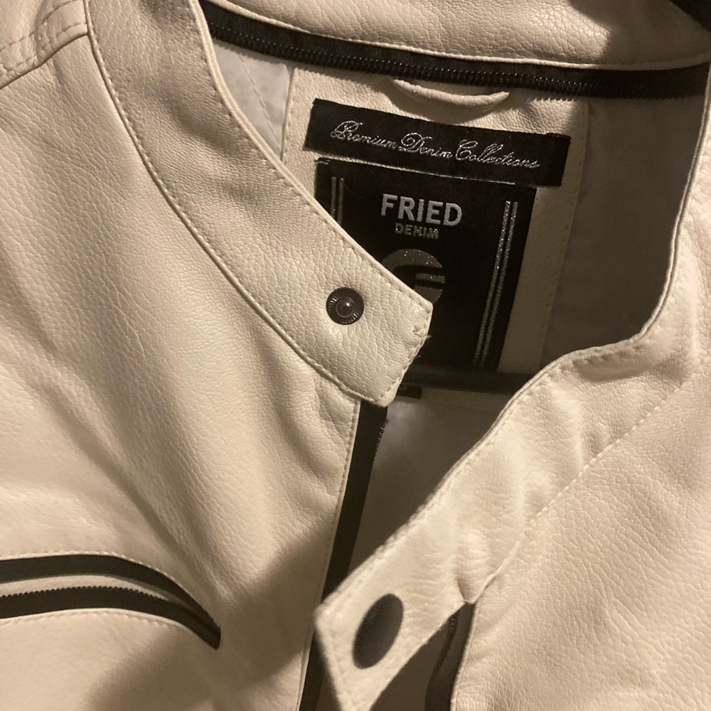 White and black leather very comfortable sleeveless jacket